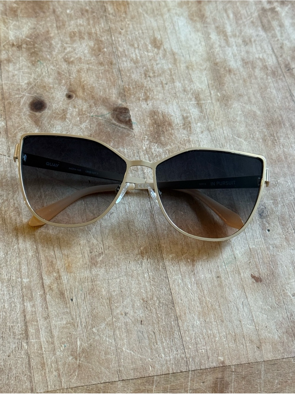 Quay Like New In Pursuit Gold